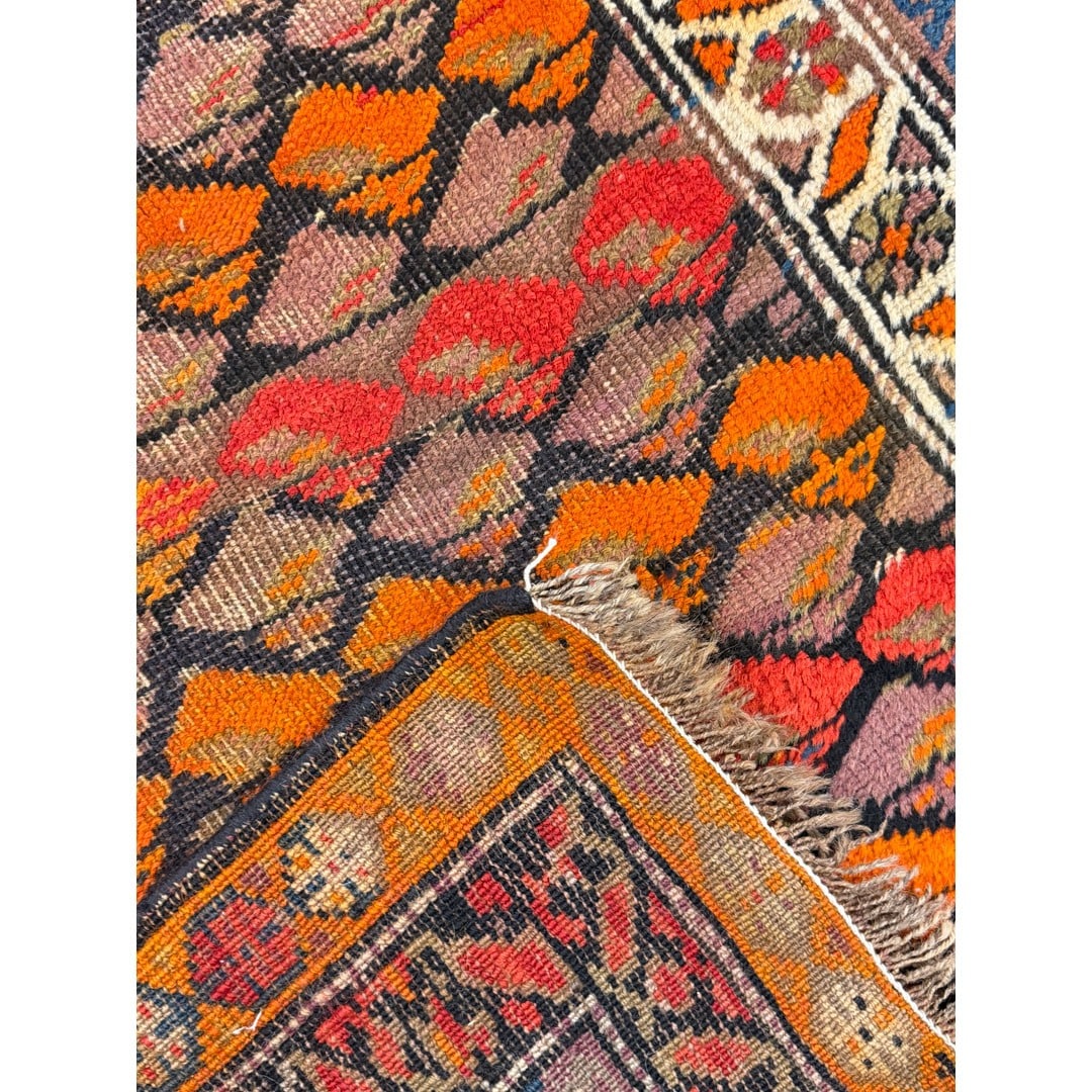 Turned-back corner showing the reverse of Kurdish Kaleidoscope rug