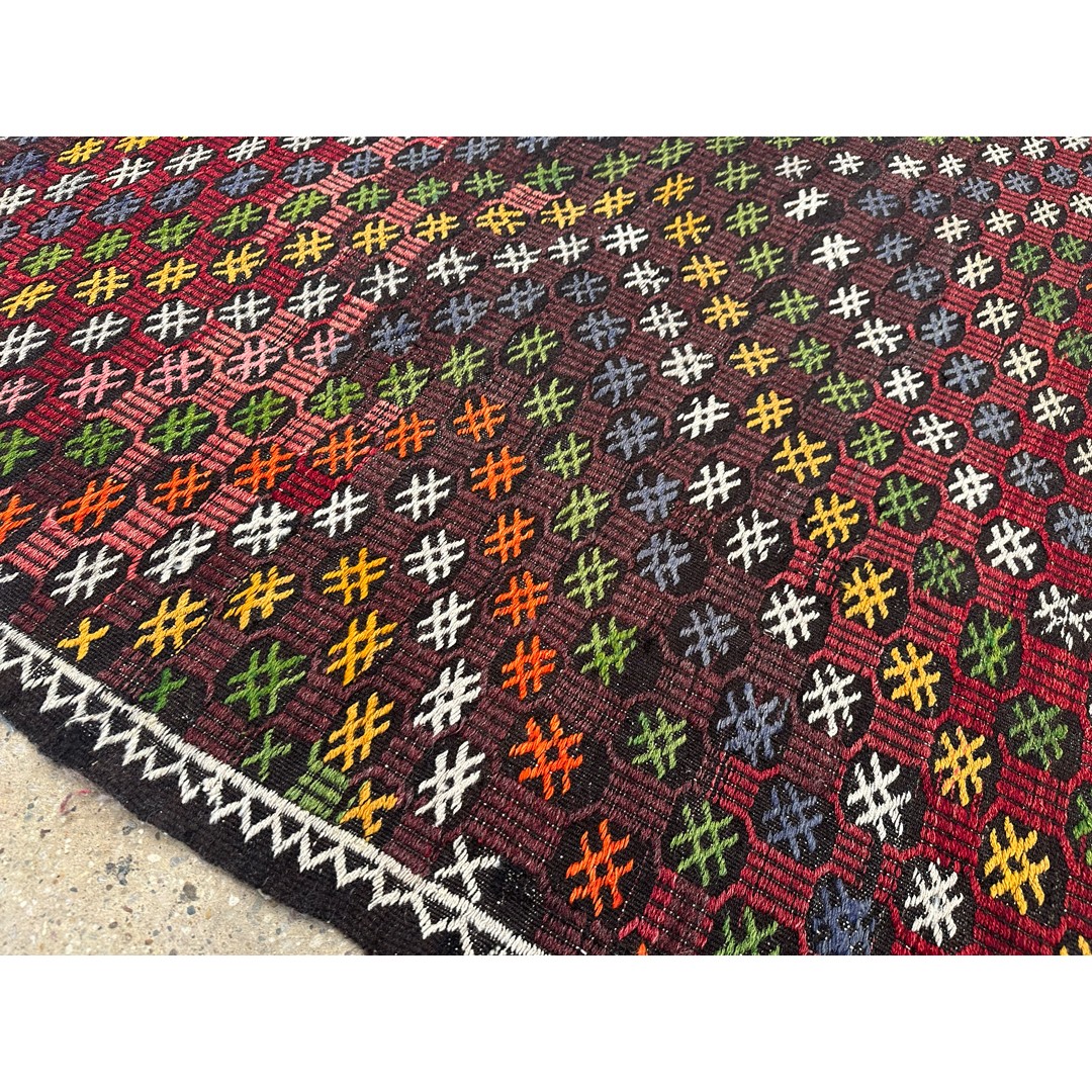 Original angled catalog photograph showing a side and corner of Kaleidoscopic Kurdish