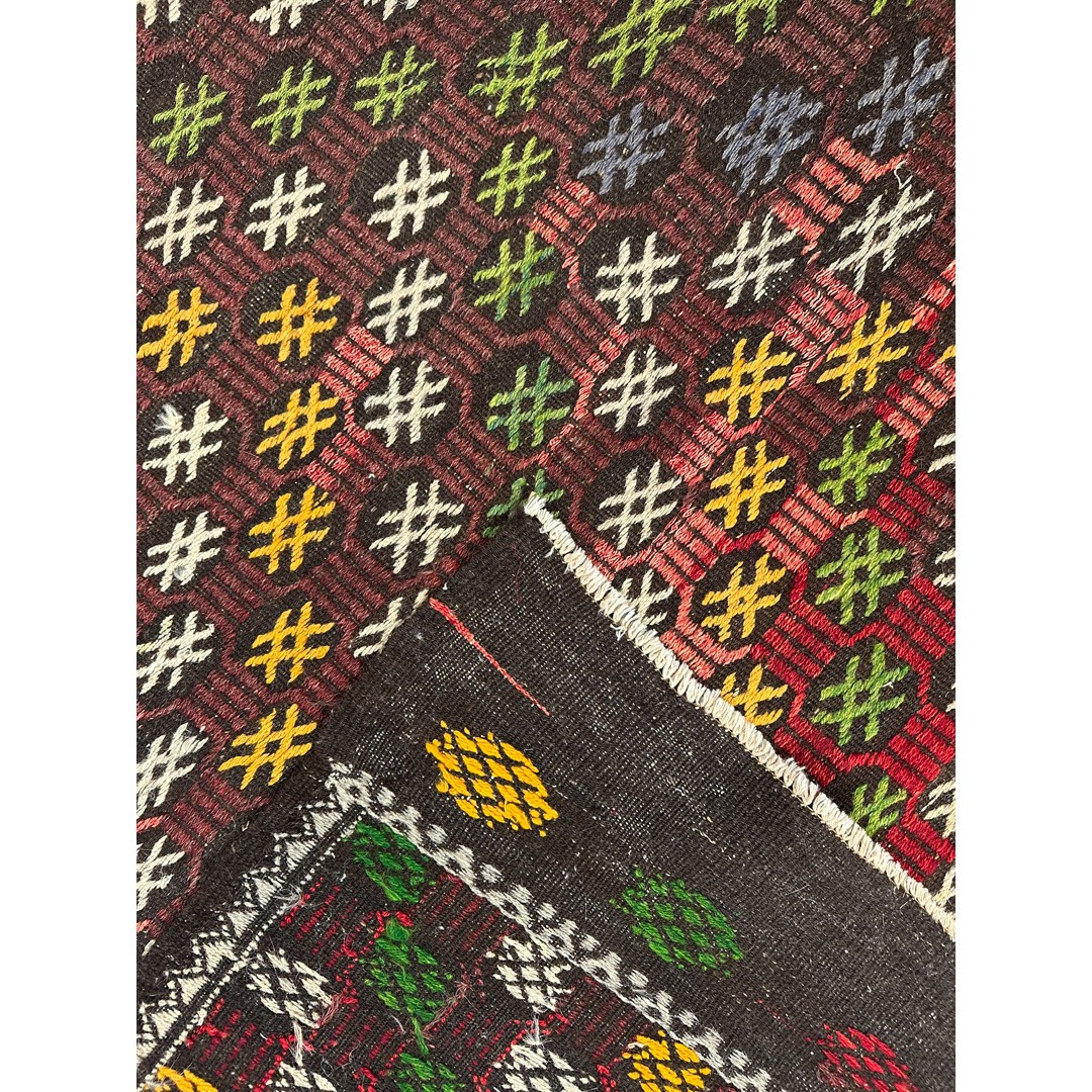 Original catalog photograph of a folded corner and reverse of Kaleidoscopic Kurdish